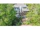 Back of home featuring a multi-story deck, pergola, and meticulously landscaped yard at 4730 W Forest Peak, Marietta, GA 30066