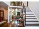 Elegant foyer with a sweeping staircase, hardwood floors, and soaring ceilings, creating a grand entrance at 4730 W Forest Peak, Marietta, GA 30066