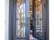 Ornate wrought iron front door with glass panels, providing a grand and welcoming entrance to the home at 4730 W Forest Peak, Marietta, GA 30066