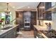 Modern kitchen features stainless appliances and dark wood cabinets at 4730 W Forest Peak, Marietta, GA 30066