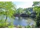 Scenic view of the lake surrounded by mature trees, showing the serene waterfront location at 4730 W Forest Peak, Marietta, GA 30066