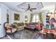 Comfortable living room with a trey ceiling, ceiling fan, built in shelves, arm chairs, and ornate furniture at 4730 W Forest Peak, Marietta, GA 30066