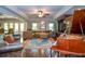 Spacious living room with hardwood floors, ceiling fan, area rug, grand piano, and access to outdoor deck at 4730 W Forest Peak, Marietta, GA 30066