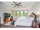 Spacious main bedroom with a tray ceiling, large windows, and stylish furnishings at 4730 W Forest Peak, Marietta, GA 30066