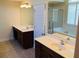 Well-lit bathroom with double vanity, tile floor and separate tub and shower at 533 Mount Gerizim Se Rd, Mableton, GA 30126
