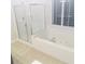 Bright bathroom features a soaking tub with jets under a window and a separate shower at 533 Mount Gerizim Se Rd, Mableton, GA 30126