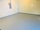 Spacious garage featuring a light gray epoxy floor, door to inside, and an electrical panel at 533 Mount Gerizim Se Rd, Mableton, GA 30126