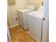 A laundry room with a washer and dryer and tile flooring at 533 Mount Gerizim Se Rd, Mableton, GA 30126