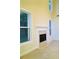 Spacious living room features a fireplace, large windows, and neutral carpeting at 533 Mount Gerizim Se Rd, Mableton, GA 30126