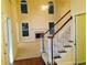 Sunlit living room with fireplace and high ceiling, viewed from the stairway at 533 Mount Gerizim Se Rd, Mableton, GA 30126