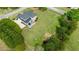 Aerial view of an estate featuring a lush lawn and mature trees at 5604 Mccullers Ln, Loganville, GA 30052