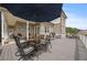 Spacious back deck with ample seating for entertaining and outdoor dining at 5604 Mccullers Ln, Loganville, GA 30052