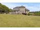 Beautiful backyard featuring a well-manicured lawn and large back deck at 5604 Mccullers Ln, Loganville, GA 30052