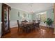 Traditional dining room with hardwood floors, chandelier lighting, and classic decor, perfect for entertaining at 5604 Mccullers Ln, Loganville, GA 30052
