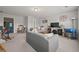 This living area includes a sofa, chair, TV, a large clock, and a blue piano at 5604 Mccullers Ln, Loganville, GA 30052