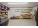 Storage room with shelving, wooden supports, concrete floor, and ample space for organizing items at 5604 Mccullers Ln, Loganville, GA 30052