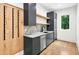 Contemporary bar area features modern cabinetry, a sink, marble countertop, and a wine rack at 820 Moores Mill Nw Rd, Atlanta, GA 30327