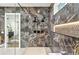Bathroom shower featuring dual shower heads, marble-style tile, and geometric inlays at 820 Moores Mill Nw Rd, Atlanta, GA 30327