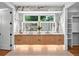 Bathroom with double sink vanity, stylish mirror and cabinetry, and large window at 820 Moores Mill Nw Rd, Atlanta, GA 30327