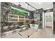 Lavish bathroom features a glass enclosed shower, soaking tub, marble accents, and decorative lighting at 820 Moores Mill Nw Rd, Atlanta, GA 30327