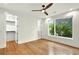 Bright bedroom with hardwood floors, ceiling fan, and ample natural light at 820 Moores Mill Nw Rd, Atlanta, GA 30327