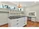 Walk-in closet with custom shelving, a center island with marble top, and hardwood floors at 820 Moores Mill Nw Rd, Atlanta, GA 30327