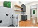 Modern dog wash station features a glass enclosure, stylish fixtures, and a convenient vanity with open shelving at 820 Moores Mill Nw Rd, Atlanta, GA 30327
