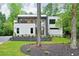 Modern two-story home with manicured lawn and contemporary landscaping at 820 Moores Mill Nw Rd, Atlanta, GA 30327