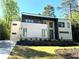Beautiful contemporary home featuring a paved driveway and landscaped front yard at 820 Moores Mill Nw Rd, Atlanta, GA 30327