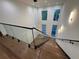 Elegant foyer showcases a glass railing staircase and hardwood floors at 820 Moores Mill Nw Rd, Atlanta, GA 30327