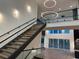 Grand foyer featuring a staircase with glass railings and modern lighting at 820 Moores Mill Nw Rd, Atlanta, GA 30327