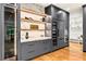 Modern kitchen with custom cabinets, wine storage, and state-of-the-art appliances at 820 Moores Mill Nw Rd, Atlanta, GA 30327