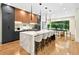 Spacious kitchen features a large marble waterfall island with seating and modern pendant lighting at 820 Moores Mill Nw Rd, Atlanta, GA 30327