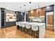 This kitchen has an oversized island with seating, sleek cabinets, and a marble backsplash at 820 Moores Mill Nw Rd, Atlanta, GA 30327