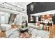 Open-concept living room with sleek kitchen, view to the stairs and upper floor at 820 Moores Mill Nw Rd, Atlanta, GA 30327