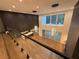 Bright open-concept living room with floor-to-ceiling windows, hardwood floors, and modern lighting at 820 Moores Mill Nw Rd, Atlanta, GA 30327