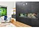 Cozy seating area with a fireplace, built-in shelves, and a view of the outdoors at 820 Moores Mill Nw Rd, Atlanta, GA 30327