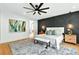 Modern main bedroom with accent wall, stylish furnishings, hardwood floors, and ample natural light at 820 Moores Mill Nw Rd, Atlanta, GA 30327