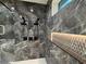 Modern walk-in shower featuring dual shower heads and beautiful dark marble tile at 820 Moores Mill Nw Rd, Atlanta, GA 30327