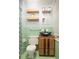 Charming bathroom featuring a unique sink, wood shelves, updated light fixture, and tiled walls at 98 Almon Church Rd, Covington, GA 30014
