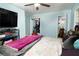 Bedroom featuring closet, view to en-suite bathroom, light blue walls and ceiling fan at 98 Almon Church Rd, Covington, GA 30014