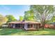 Spacious backyard featuring a screened-in porch and mature trees at 2685 Buena Vista Ave, Doraville, GA 30340