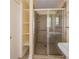 Bathroom showing a shower with tile surround, and shower door, plus a linen closet at 2685 Buena Vista Ave, Doraville, GA 30340