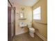 Bathroom with a pedestal sink, tile floors, shower, and a comfort-height toilet at 2685 Buena Vista Ave, Doraville, GA 30340
