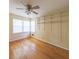 Bedroom with hardwood floors, ceiling fan, and bright, sunny exposure at 2685 Buena Vista Ave, Doraville, GA 30340