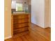 Dining area featuring hardwood floors, brick accent wall, and shelving at 2685 Buena Vista Ave, Doraville, GA 30340