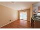 Bright dining room with hardwood floors, and sliding glass doors to the sunroom at 2685 Buena Vista Ave, Doraville, GA 30340
