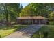 Charming one story brick home with a well manicured lawn, mature trees and a long driveway at 2685 Buena Vista Ave, Doraville, GA 30340