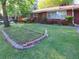 Charming front yard featuring well-maintained landscaping and a classic brick home at 2685 Buena Vista Ave, Doraville, GA 30340