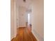 Hallway features hardwood floors, white walls, and leads to rooms in the house at 2685 Buena Vista Ave, Doraville, GA 30340